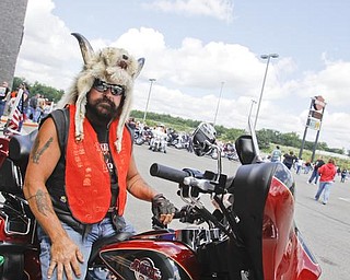 Stan Chlebus of Ellsworth gets ready to ride off for the opening of the bike ride event to raise money for several charities at Harley Davidson Biketown in Austintown. Sunday July 19, 2009
Lisa-Ann Ishihara