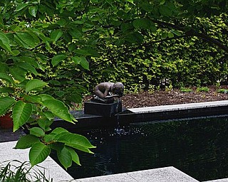 Once at a museum in Bexley, Ohio, the "Drinking Girl Fountain" is now surrounded by scented bushes with names such as "Sovereign," "Blue Kentucky Girl" and "Copper Luster."