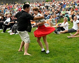 Mineh Ishida, of Cleveland, and Lisa Pitzer, of Newton Falls, dance to Big Bad Voodoo Daddy