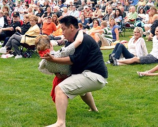 Mineh Ishida, of Cleveland, and Lisa Pitzer, of Newton Falls, dance to Big Bad Voodoo Daddy