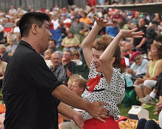 Mineh Ishida, of Cleveland, and Lisa Pitzer, of Newton Falls, dance to Big Bad Voodoo Daddy