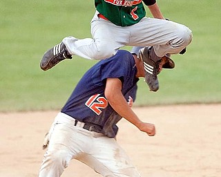 Rondinelli Tuxedo's Phil Lipari jumps over Ohio Hurricane's Joe Chiaroppa after outing him at second base during the fourth inning at Cene Field on Monday evening.