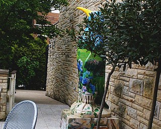 The fountain area is part of Beecher Terrace and shares space with the Gardens' painted penguin.