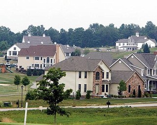 These homes in the Firestone Farms development in Columbiana County are not being foreclosed upon, but National City Bank has filed foreclosure action against Meadowbrooke Development.