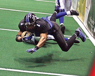 Quorey Payne of the Mahoning Valley Thunder flies through the air after breaking a tackle during their June 19 game against the Manchester Wolves at the Covelli Centre in Youngstown. 