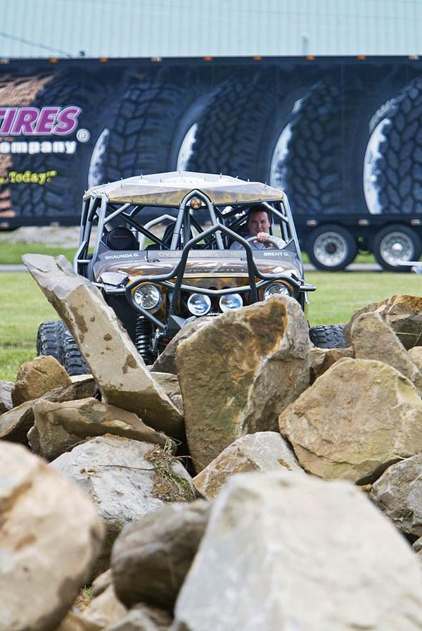 ROCK ON: With his remodeled 2009 Jeep, Brent Goegebuer of 4 Wheel Parts examines the Rock Crawl Challenge set up at the fairgrounds. 