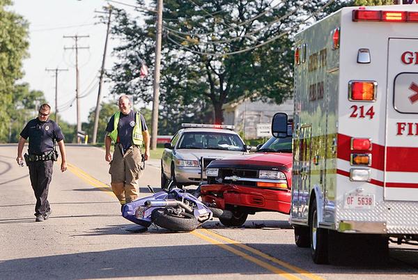 An Officer from Goshen Twp and rescue personnel from the Green Fire Dept.  investigate a crash early this morning on Lisbon Rd. in front of Greenford Christian Chruch that involved a motorcyclist and a car.  The motorcyclist was not there when i arrived and the officer said he was still investigating - robertkyosay
