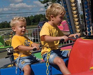 Alex LaPlante, 2, and big brother Nicholas, 5, both of Poland, enjoyed a ride together at the Canfield Fair two years ago.