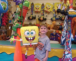 Andrei Pagnotta shows off a prize he won himself at the Mount Carmel Festival in Lowellville.