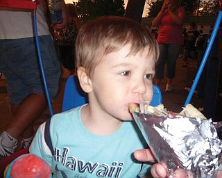 This is Willy Rankin at the Canfield Fair taking a bite of his dad's gyro sandwich.