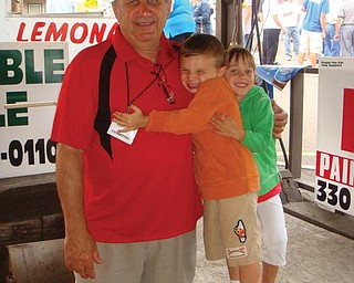Olivia Coppola of Union, Ky., and Kevin Johnson Jr. of Pickerington were at the Mount Carmel Festival in Lowellville with their 'papa' Bob Coppola of Lowellville, president of the Mount Carmel Club.