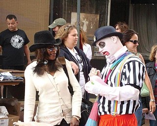 Tina Marie Williams with a clown at the Pig Iron Fest.