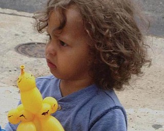  A young child in the crowd at the Pig Iron Fest.