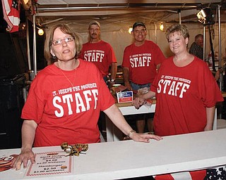 The cooks pictured at St. Joseph the Provider Church Summer Festival in Campbell in June are, from left, Cheryl Jablonski, school principal; John Walczak, athletic director; the Rev. Mike Swierz, pastor; and Julie Cox, cafeteria supervisor.