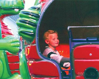 Tyler Surrena of Youngstown is enjoying a festival ride.