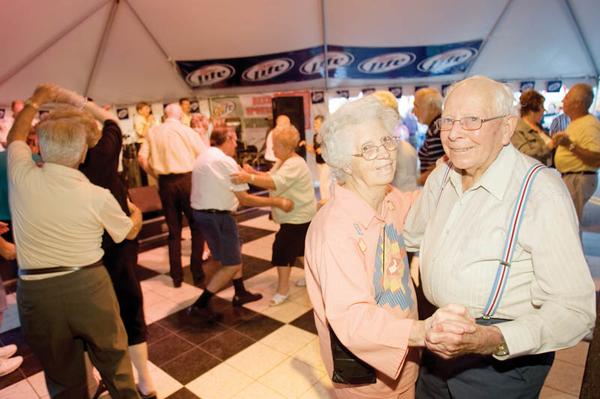 LOVE OF DANCE: Grace, 88, and Harry Ripley, 94, of Campbell dance to the country song “I Just Want to Dance With You” by George Strait at the Greater Youngstown Italian Festival. “Wherever we can dance, we go,” Harry said. The couple visits the festival every year.