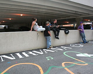 People hanging out at David Grohl Alley in Warren.
