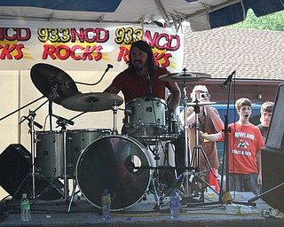 Dave Grohl performs with local band Love Turns Hate at the David Grohl Alley dedication ceremony in Warren.
