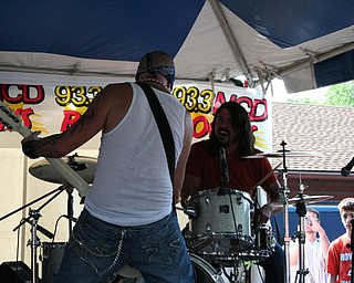 Dave Grohl performs with local band Love Turns Hate at the David Grohl Alley dedication ceremony in Warren.