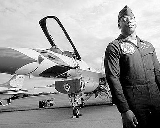 LEAD PILOT: Major Tyrone Douglas, originally from Kansas City, Mo., is the lead solo pilot in the Air Force Thunderbirds exhibition team. He stands in front of the F-16 he’ll fly in this weekend’s air show at the Vienna Air Base. More than 80,000 spectators are expected at the two-day event.