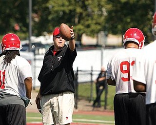 Coach Heacock talks to the team as they set up drills on the first day of practice at YSU.