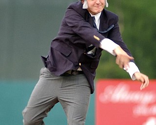 Phil Eckenrode, of Mineral Ridge, Ohio, throws out the first pitch prior to the Mahoning Valley Scrappers game against the Jamestown Jammers, Wednesday, Aug.14, 2002, in Niles, Ohio. Eckenrode was dressed up as James Traficant. The Single-A affiliate of the Cleveland Indians made August 14 ``Jim Traficant Night,'' and hairpiece wearers and sons of truck drivers got in free. The former Ohio congressman, serving an eight-year prison sentence for bribery and racketeering, often calls himself ``the son of a truck driver.''