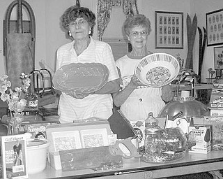 Special to The Vindicator
OUT OF SORTS: Items are being carefully sorted by, from left, Sofia Froom and Dot Leo, who are part of a committee involved in preparing the collection for a sale to take place from 10 a.m. to 4 p.m. Friday and Saturday at the barn on the property at the Ward-Thomas Museum, 503 Brown St., Niles. Clothing, rugs, household items, books, lawn mowers and other equipment will be available for bargain hunters. Hot dogs and pop will also be sold. Proceeds will benefit Niles Historical Society and will be used for the upkeep of the museum and grounds. For more information call the museum, (330) 544-2143.
