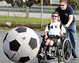 SOCCER - Joe Bundy (pushing) directs Rocky Maiorca to a goal Sunday afternoon. - Special to The Vindicator/Nick Mays