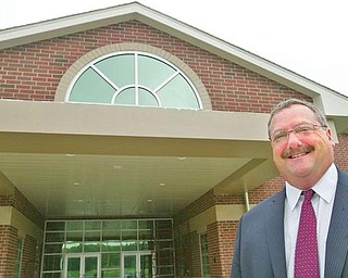 IN CHARGE: Kirk Baker, Jackson-Milton superintendent, near the entrance of the new facility.