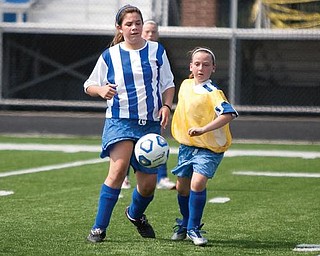 The Vindicator/Geoffrey Hauschild
Genna Cramp and Gina Cooper watch as the soccer ball bounces in front of them during a game at Poland High School.
8.15.2009