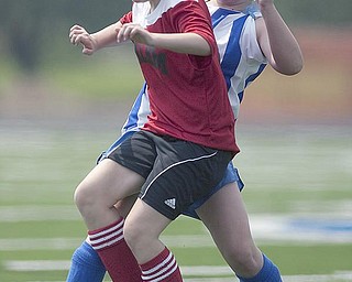 The Vindicator/Geoffrey Hauschild
Poland U14's Miranda Easterbrooke, 13, (right) steals the ball from Salem's Madison Schwartz, 13, (front) during a game at Poland High School.
8.15.2009