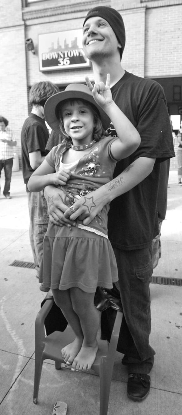 The Vindicator/Robert K. Yosay -----
VEXFEST 6 - Its all music as Angelina 7 with her dad Jason Smith of Niles listens to the music on Stage West  - 9-23-2009