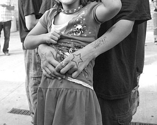 The Vindicator/Robert K. Yosay -----
VEXFEST 6 - Its all music as Angelina 7 with her dad Jason Smith of Niles listens to the music on Stage West - 9-23-2009