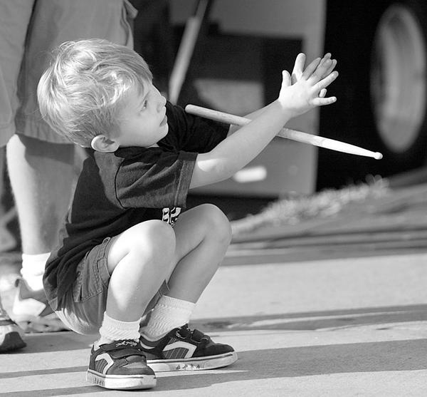 The Vindicator/Robert K. Yosay -----
VEXFEST 6 -  Boy in the Band   Richard Yaist  -4- plays with a drum stick he got from the band   he was there with Lisa and Will his parents from youngstown - 9-23-2009