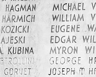 LASTING TRIBUTE: The names of 42 young men from Woodrow Wilson High School killed in World War II and the names of three who died in Vietnam are listed on the war memorial now adorning a wall at Wilson Middle School on Gibson Street. Local Gold Star Mothers raised the money to build the memorial after World War II, and it was originally attached to Wilson High School which no long exists.