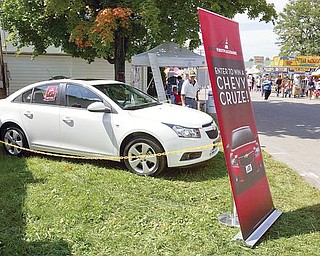CRUZE CONTROL:  An Asian-built Chevrolet Cruze is displayed at the Canfield Fair. The Cruze will be manufactured at the GM Lordstown plant. First Place Bank announced a contest Thursday in which three people will win the first cars built there.