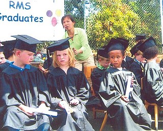 Brandon Moody Byrd, third from the left, and his classmates are shown on graduation day from Rockridge Montessori Preschool in Oakland, Calif. He is the grandson of Mary Moody.