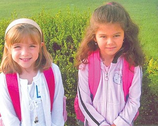 Best friends Sophia Mellott, left, and Lindsay Zublena are first-graders at Lynn Kirk Elementary in Austintown.