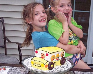 Gabrielle Eberly, who is in the fifth grade at Canfield Village Middle School this year, and her sister, Holly, a second-grader at C.H. Campbell in Canfield, are greeted by a school bus cake every year when they get home from their first day of school. Their mom, Sherre Eberly of Canfield, has has been doing this for six years.