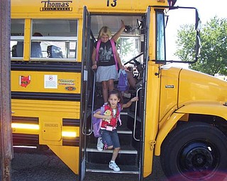Angelina Estes of Girard is coming home on her first day of school carrying her 'rescue pet.' Two years later, 'Sparky' is still her favorite but stays home till she gets back.