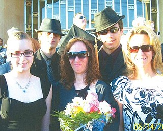 Wendy Jenkins of Boardman (center) is all smiles as she poses with her proud kids, Brittany, Bobby and Billy Jenkins, all of Boardman, and her sister (right), Cheri Fisher of Phoenix, Ariz., after receiving her nursing degree in May from Mercy College of Northwestern Ohio.