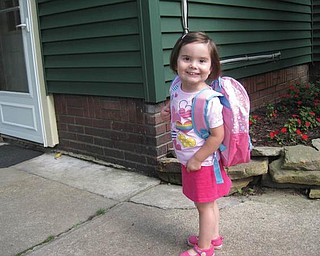 This is 3 1/2-year-old Carley Johnston getting ready for her orientation play date on Aug. 18 Holy Family Preschool in Poland. She is very proud of her princess book bag!