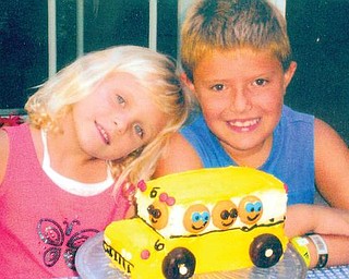 Erin, 5, and Michael, 8, Chaplow of Canfield celebrated their first day of school last year with a family cookout and a 'bus cake' for dessert.