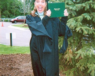 8. Toni Shields Acevedo of Boardman shows her excitement after earning a master's degree in teaching at Marygrove College in Detroit, Mich. She is also a graduate of Youngstown State University.