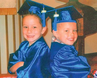 Ethan Clark, 6, left, and Brady Kridler, 5, both of Columbiana, on preschool graduation day.
