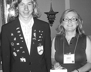 Special to The Vindicator
COMING ACROSS: Traveling from Graz, Austria, to Youngstown recently was Gerald Rosenkranz, who was welcomed at the Aug. 26 meeting of the Youngstown Rotary Club by Mary Wombel, club president. The young foreign exchange student, who is sponsored by the Youngstown Club, brought greetings and a banner from the Rotary Club in Graz. He will be a junior at Canfield High School and live with three families during his year in the United States. He is presently living with Rich and Erica Abel in Canfield.
