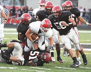 STRUTHERS - GIRARD - (17) Keith Auman of Struthers can't get away from the Girard defense during their game Friday night. - Special to The Vindicator/Nick Mays