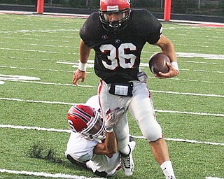 STRUTHERS - GIRARD - (36) Michael Floravit breaks away from (25) Dylan Duchak during their game Friday night. - Special to The Vindicator/ Nick Mays