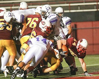 The Vindicator/Robert K. Yosay ---TD TD - #44 Mark Brandenstein pushes thru the line #14 DeSales Nick Gentile trys to stop him but failed --942009
