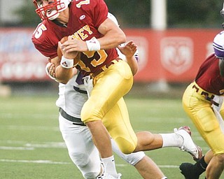 The Vindicator/Robert K. Yosay -----Alex Zordich breaks thru #55 DeSales David Weatherholt as he picks up a first and 10 during first half action at Stambaugh Stadium - 942009